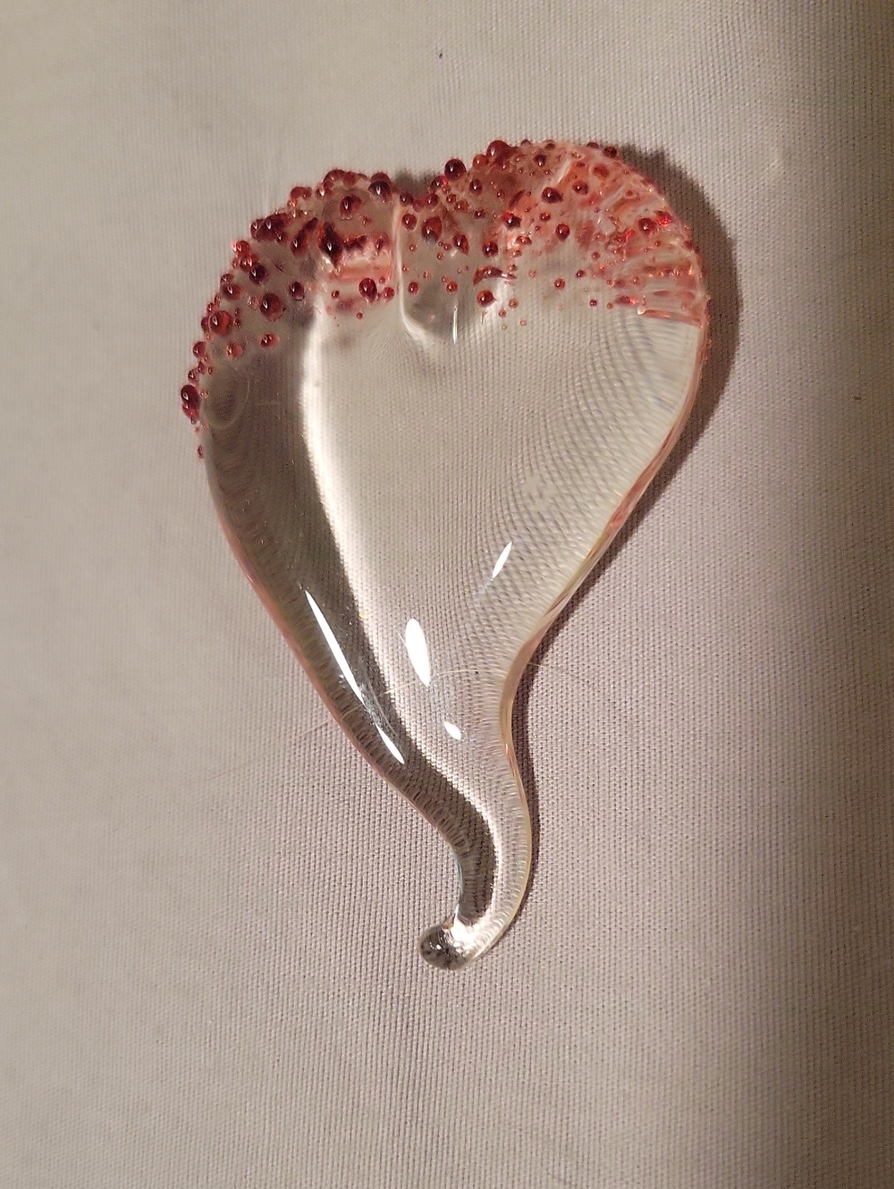Clear Glass Heart paperweight with red Raised top edge